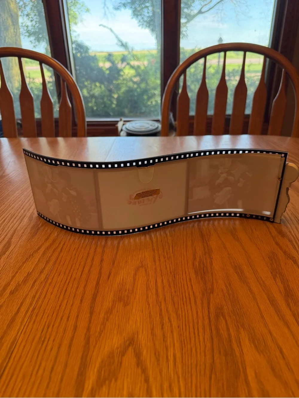 Vintage Black Filmstrip Photo Frame with Figurine Accent